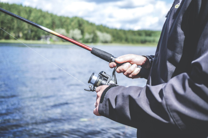 a person fishing on the lake
